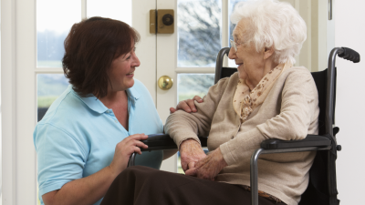 Female CNA with female resident in nursing home
